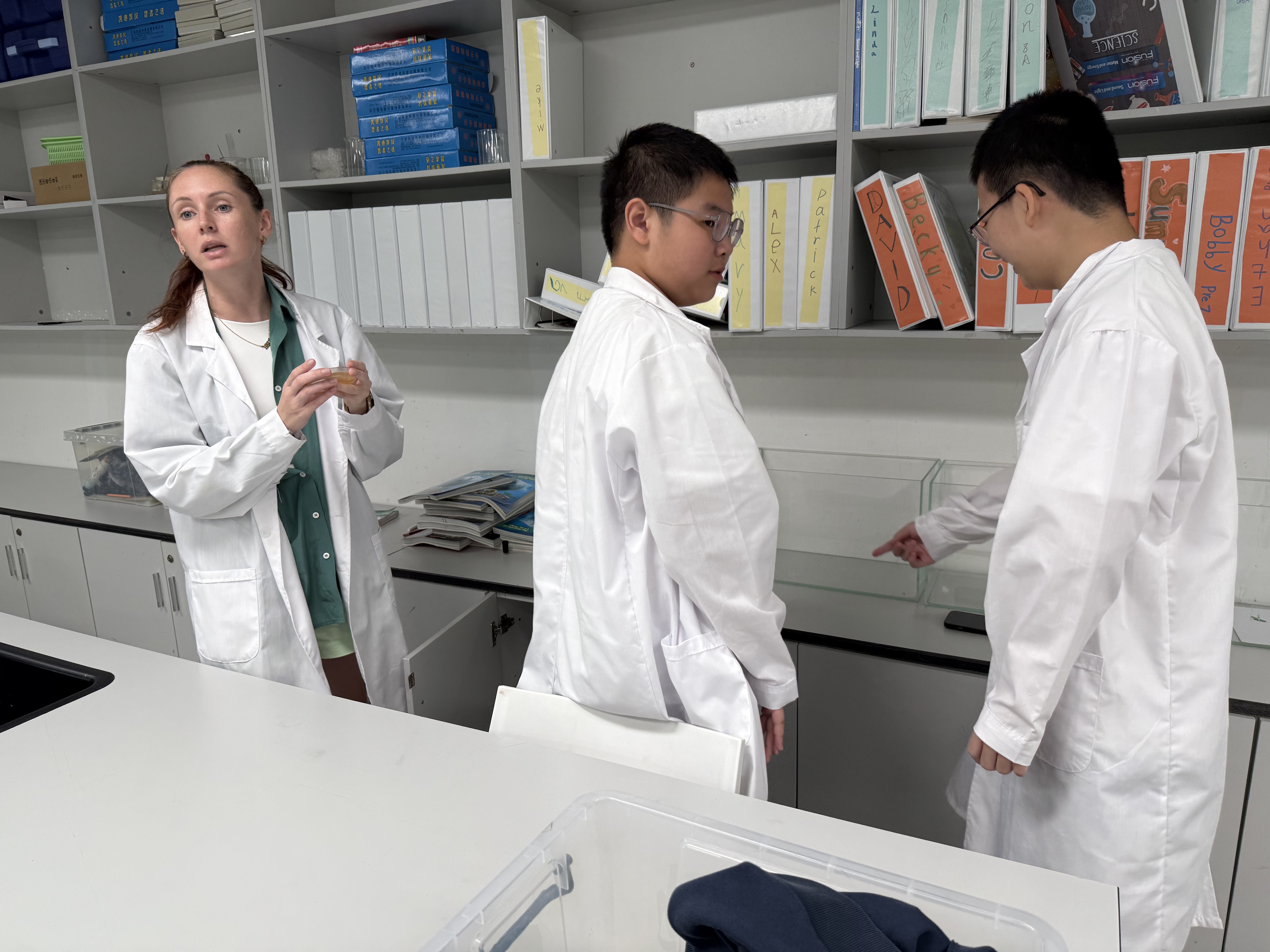 Margaryta instructing on petri dishes